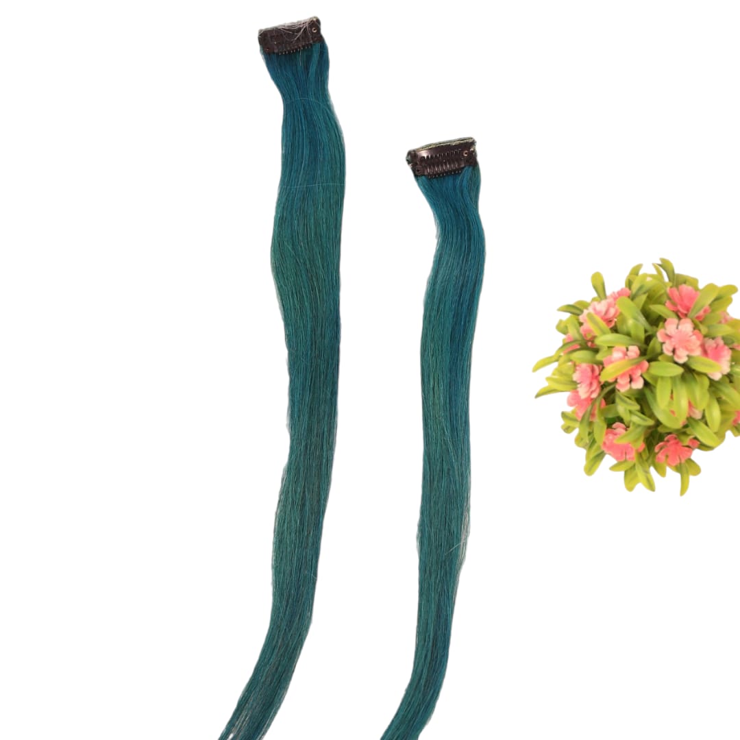 Two teal hair extensions with brown clips on a white background, accompanied by a small floral arrangement.